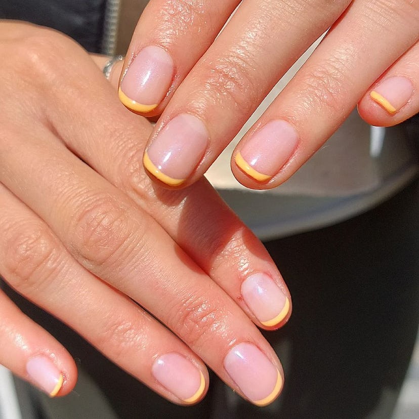 Try sunny yellow French tip nails.