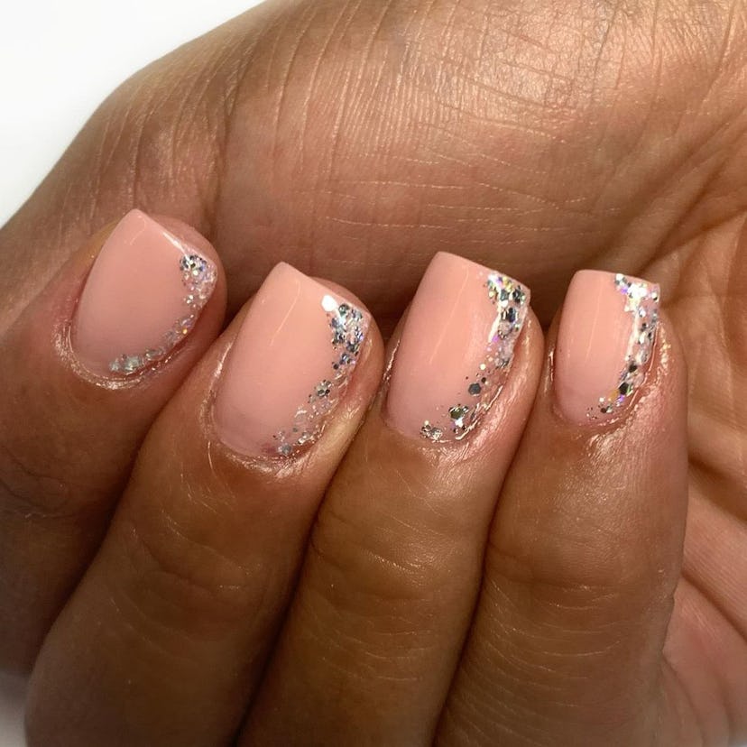 Try simple nails with a bit of glitter.