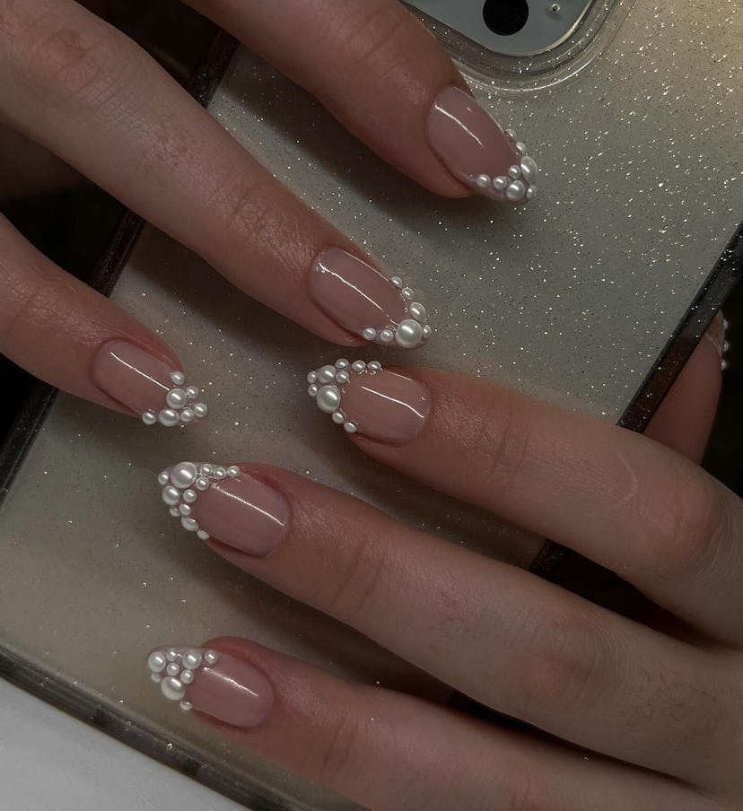 Pearl-encrusted French tip nails are perfect for Gemini season 2024.