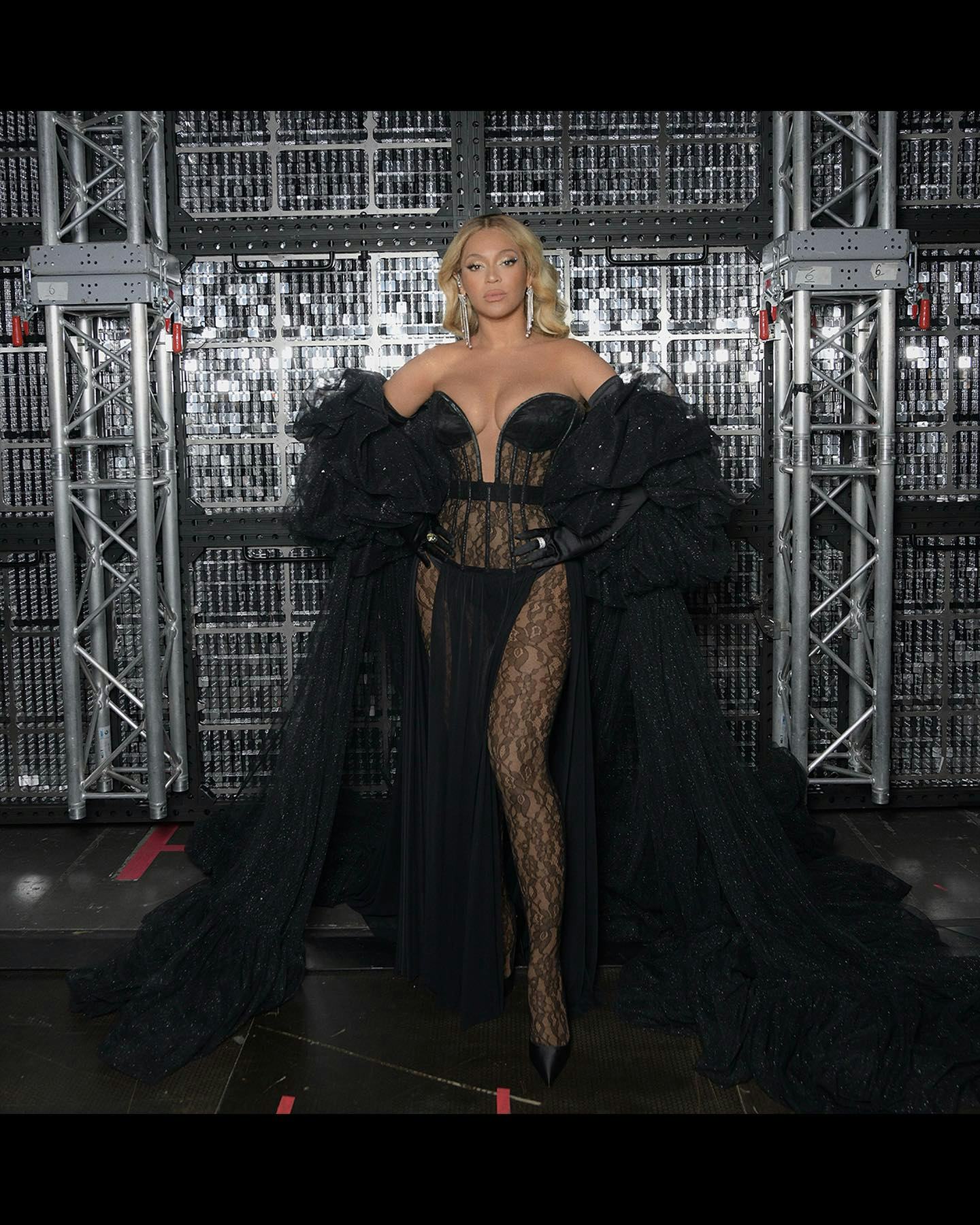 Beyonce back stage at her Renaissance tour, wearing a strapless corset gown.