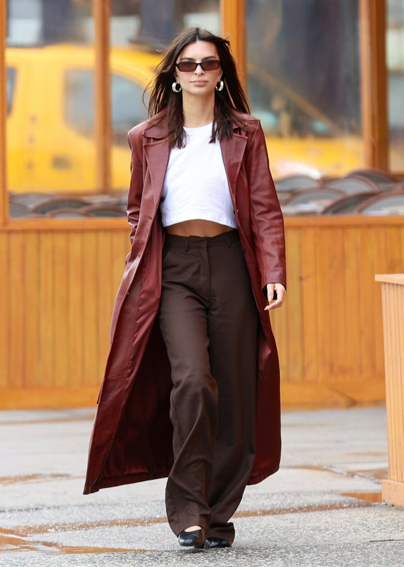 Emily Ratajkowski is seen on May 17, 2024 in New York City wearing a maroon leather duster jacket