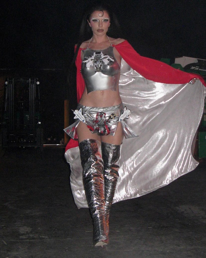 Julia Fox wore a silver breast plate outfit with a cape and thigh high boots to film OMGFashun! in N...