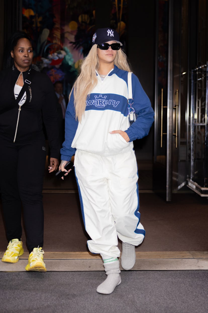 Rihanna wears white sweats and gray sock boots