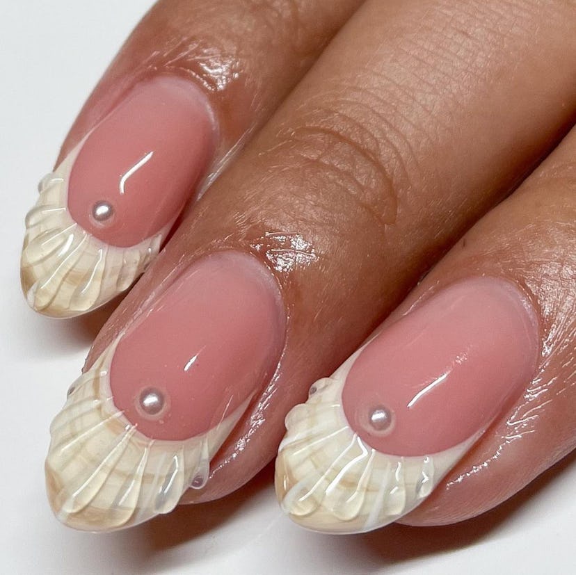 3D seashell French tip nails are on-trend for summer 2024.