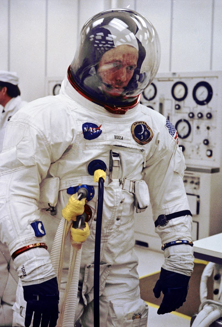 pohoto of an astronaut in a white spacesuit and bubble helmet