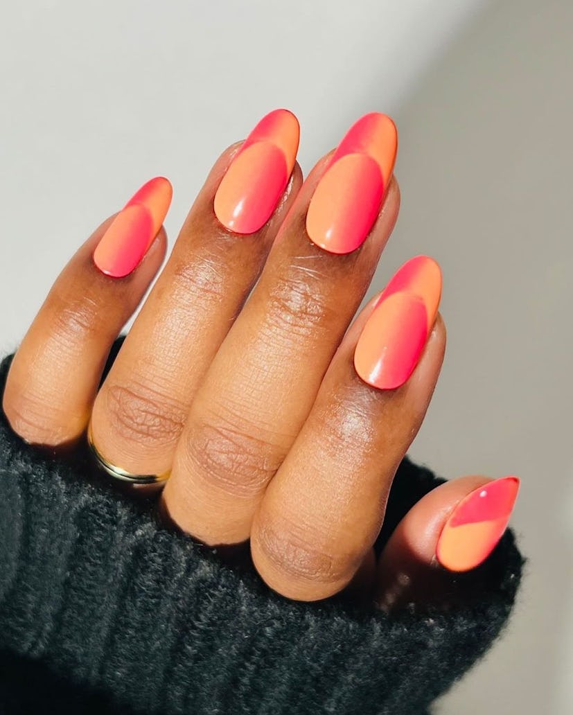 Orange illusion French tip nails are on-trend for summer 2024.