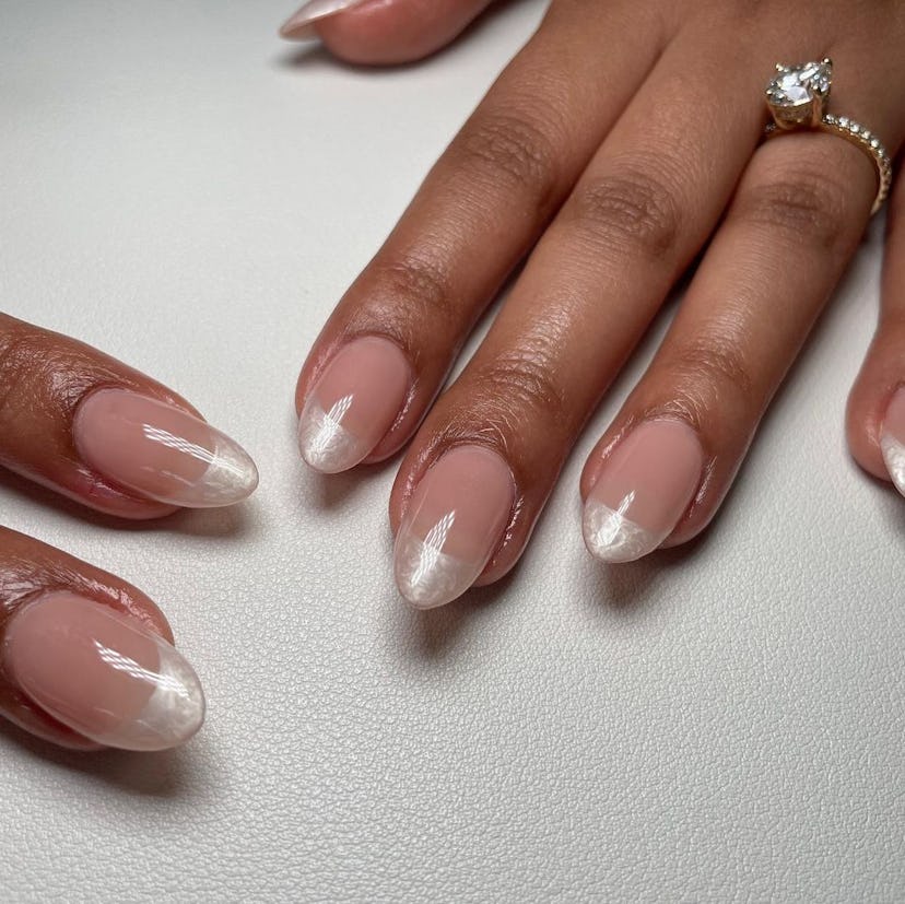 Oyster French tip nails are on-trend for summer 2024.