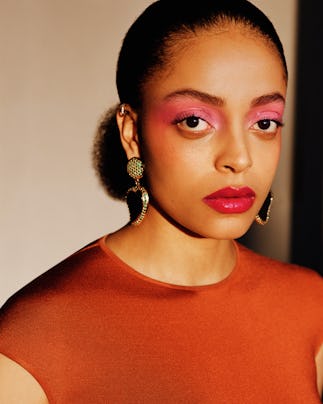 a person wearing colorful makeup