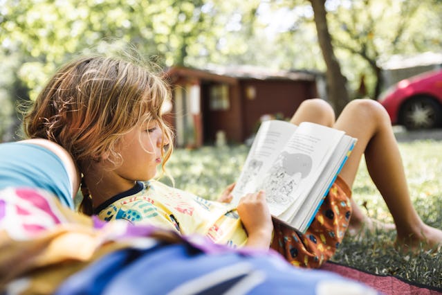 A child reads during the summer.