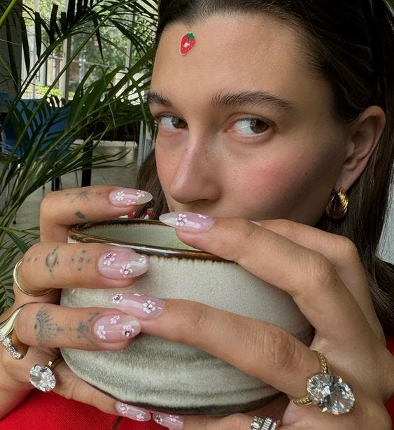 Hailey Bieber shared her cherry blossom manicure.