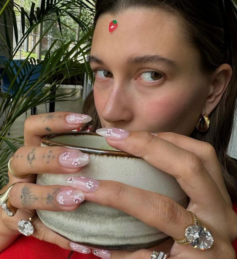 Hailey Bieber shared her cherry blossom manicure.
