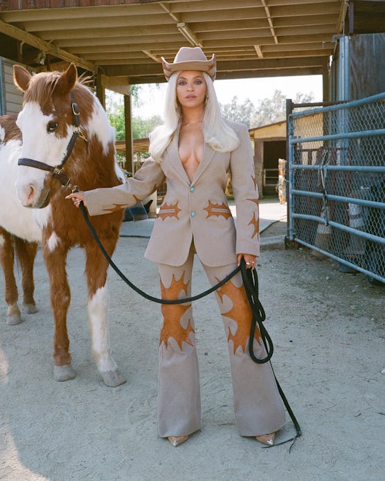 Beyoncé in Louis Vuitton suit with horse. 