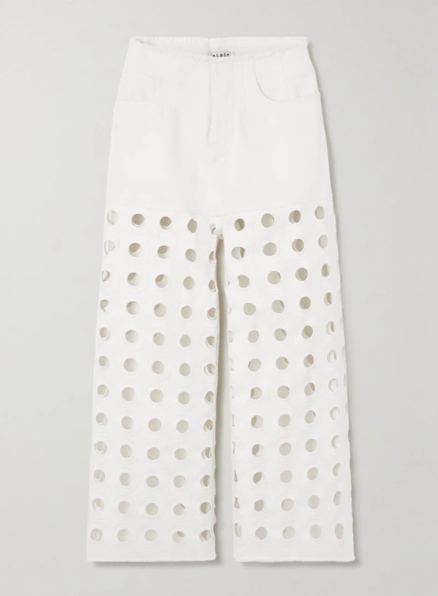 Embroidered laser-cut frayed low-rise jeans