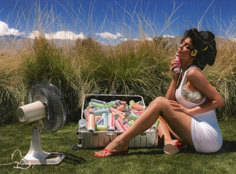 Kylie Jenner stars in a new summer campaign for her canned vodka seltzer brand Sprinter wearing outf...
