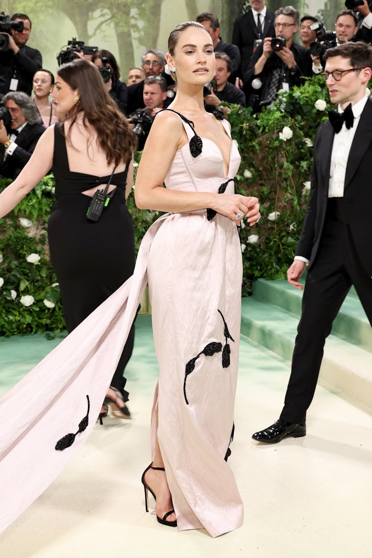 Lily James attends The 2024 Met Gala Celebrating "Sleeping Beauties: Reawakening Fashion" at The Met...