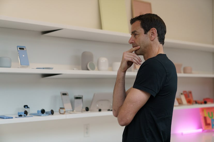 Claude Zellweger, Google’s Director of Industrial Design looking at a wall of Pixel products in vari...