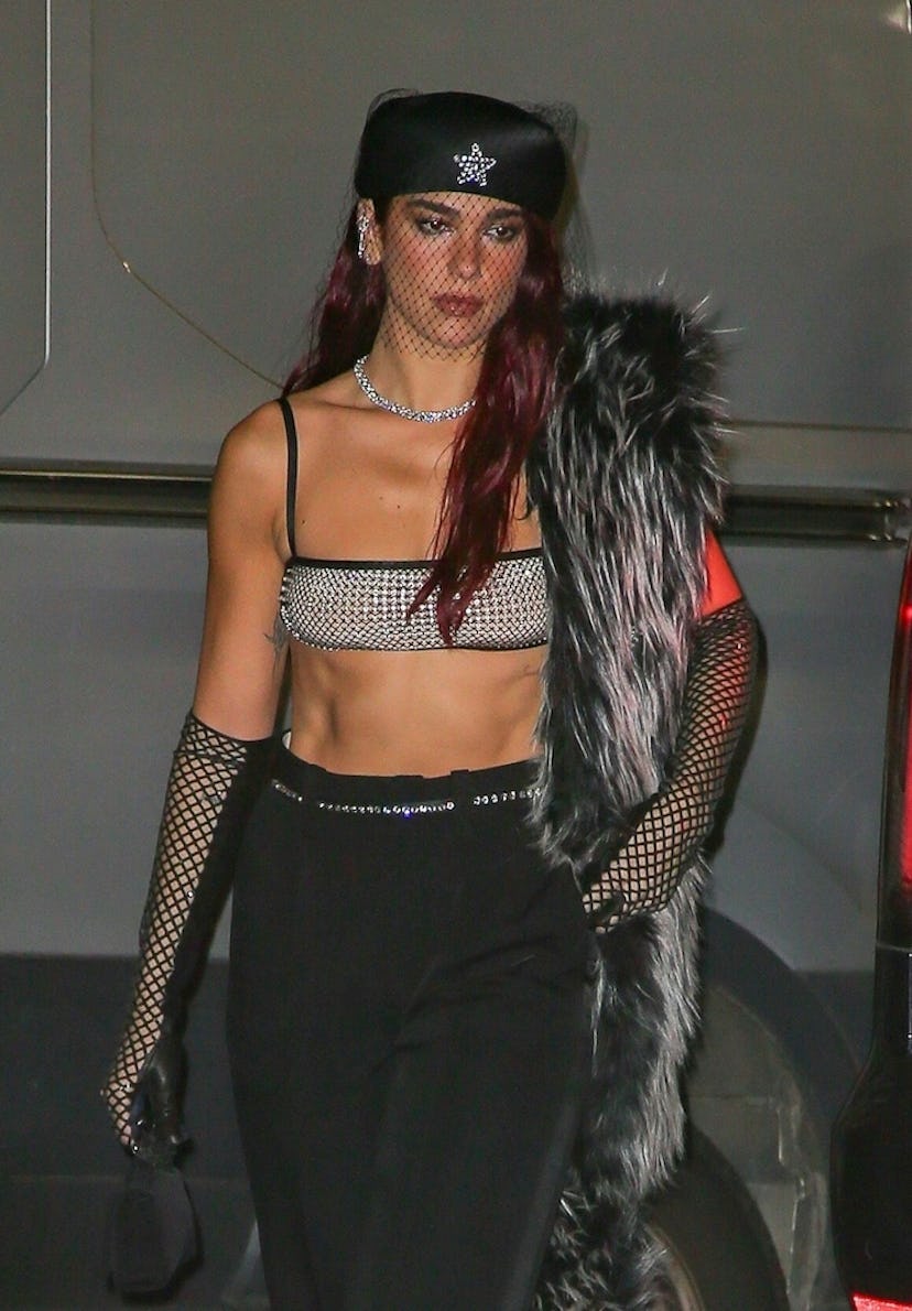 dua lipa attends the 2024 met gala after parties in a rhinestone bra and jeans