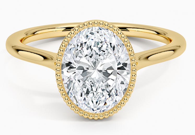 gold engagement ring with oval diamond