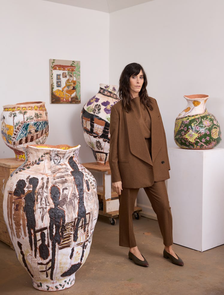 Jennifer Rochlin, wearing a Loro Piana jacket, top, pants, and shoes, in her Los Angeles studio with...