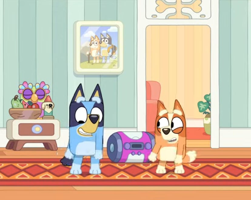 Bluey and Bingo dance in their hallway.