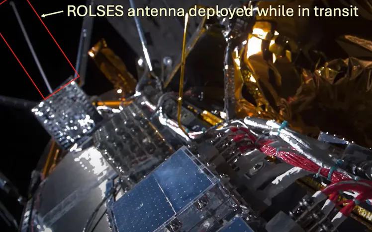 photo of a spacecraft with a deployed antenna highlighted in a red box
