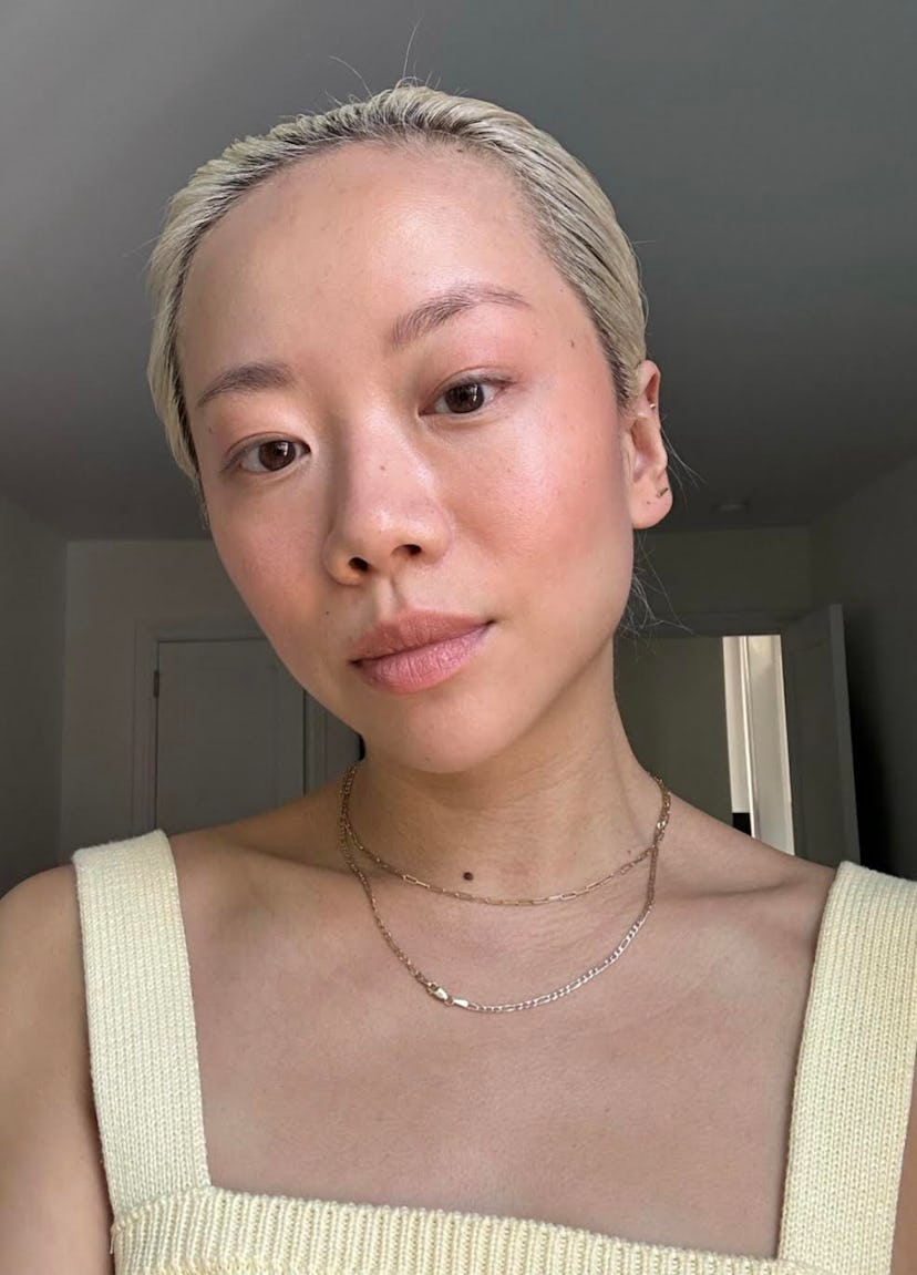 Faith Xue tests out the Rhode Pocket Blushes in shade Freckle.