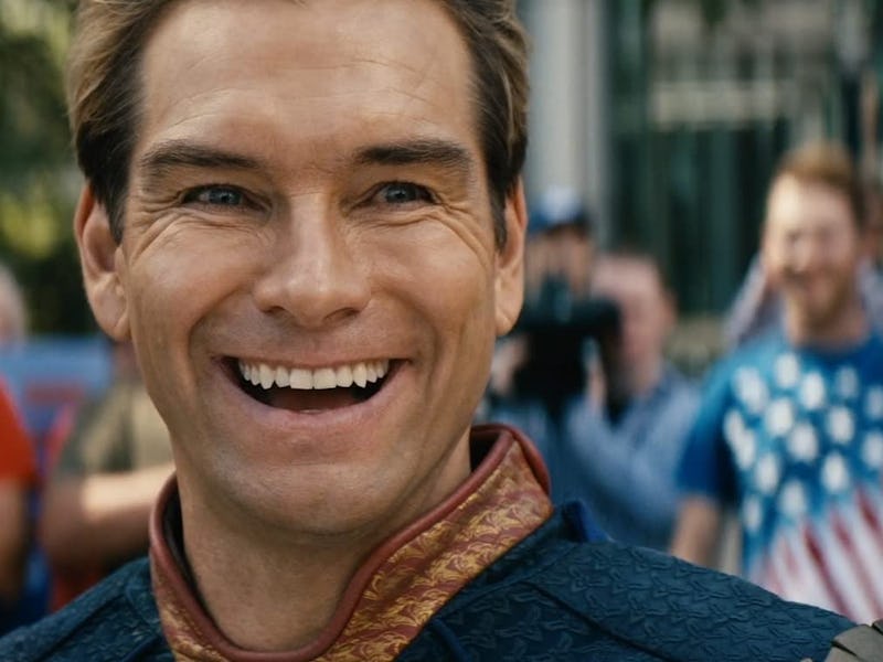 Close-up of a man with a big smile, wearing a superhero costume, with blurred cheering crowd in the ...