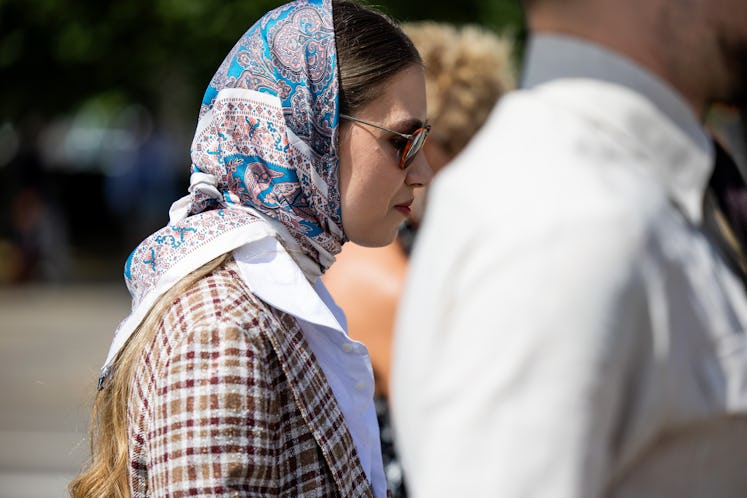 A guest wears head scarf during Pitti Immagine Uomo 106 on June 12, 2024 in Florence, Italy. 