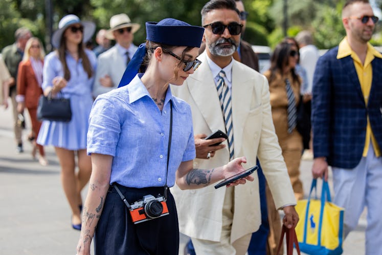 A guest wears navy hat, blue button shirt during Pitti Immagine Uomo 106 on June 11, 2024 in Florenc...