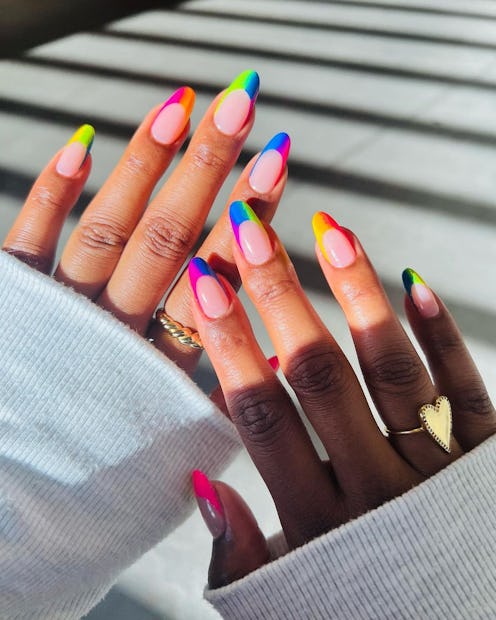 Put rainbow French tips on your nails for the ultimate colorful Pride manicure.