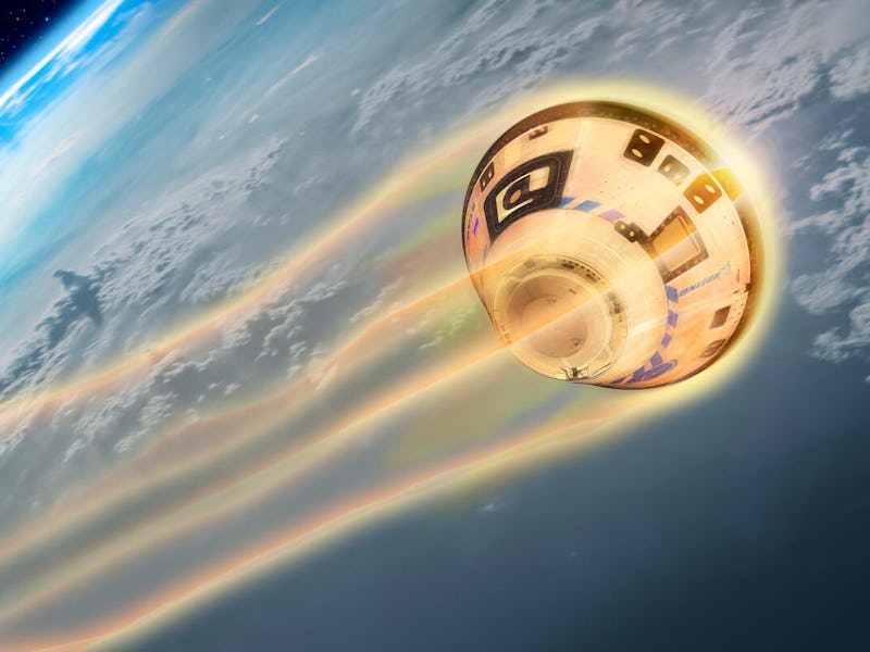 A spacecraft reentering Earth's atmosphere, emitting colorful contrails as it descends against a bac...