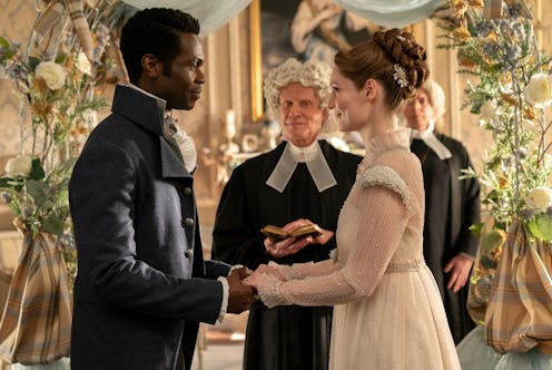 A bride and groom holding hands at their wedding ceremony, surrounded by elegant decor and a priest ...