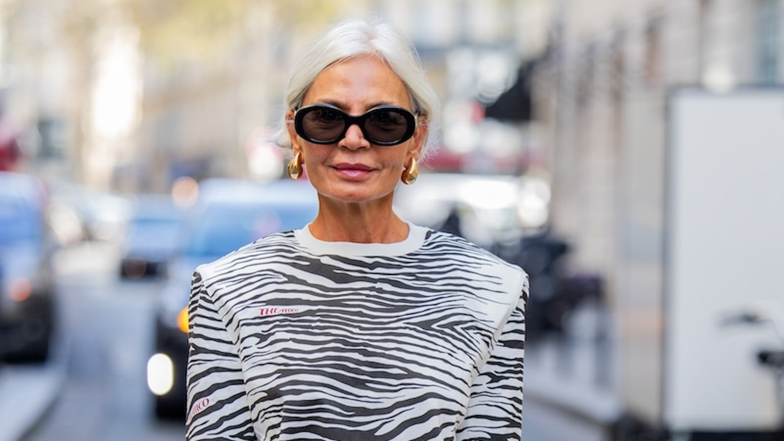 PARIS, FRANCE - OCTOBER 02: Grece Ghanem wears zebra print shirt, beige skirt, brown bag outside AZ Factory during the Womenswear Spring/Summer 2024 as part of Paris Fashion Week on October 02, 2023 in Paris, France. (Photo by Christian Vierig/Getty Images)