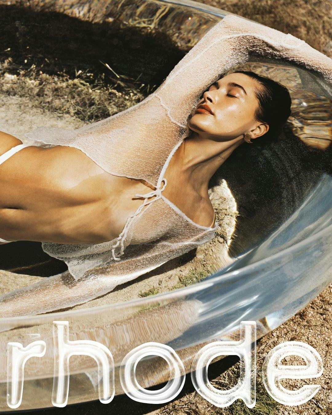 Hailey Bieber poses in a Rhode campaign.