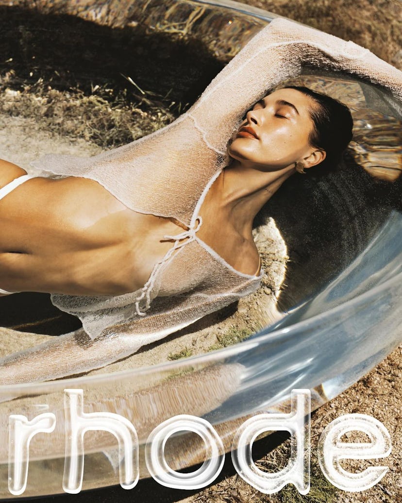 Hailey Bieber poses in a Rhode campaign.