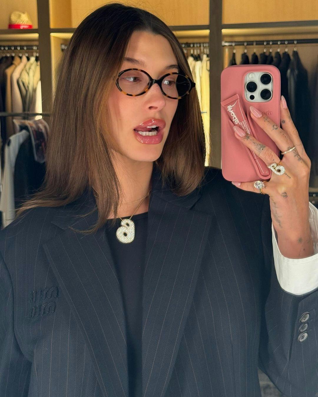 Hailey Bieber poses in a Rhode campaign.