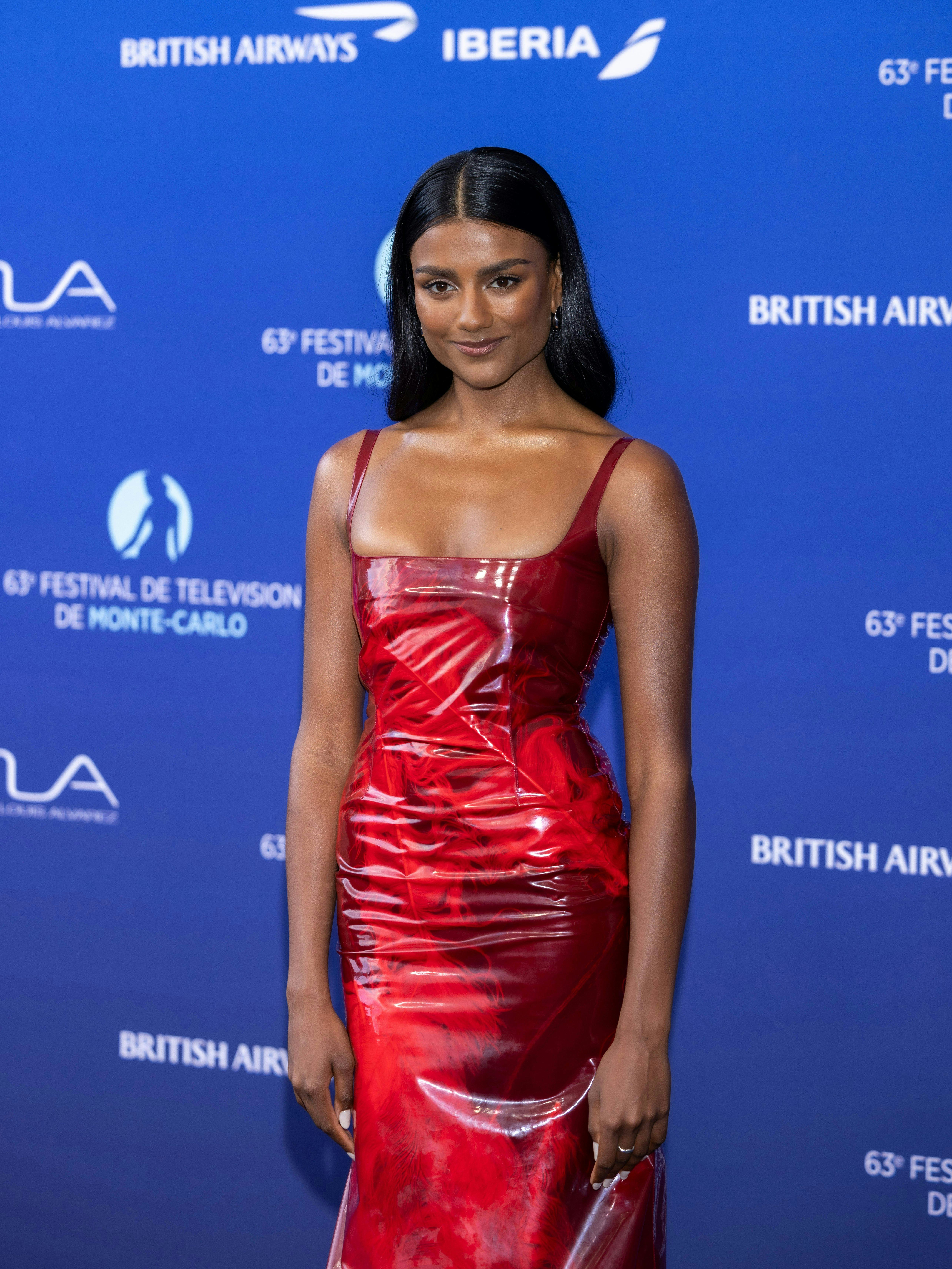 Simone Ashley Amps Up a Second-Skin Corset Dress With Naked PVC Heels