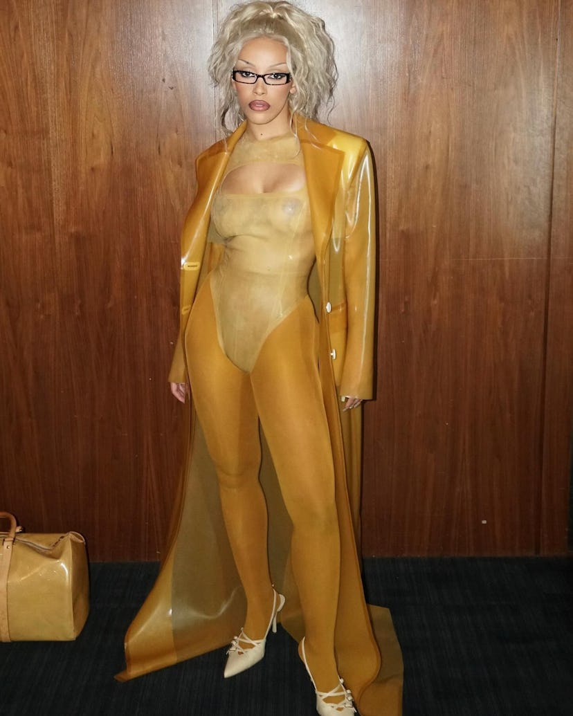 Doja Cat posted the NSFW butterscotch latex look from Parisian brand Avellano to Instagram post-perf...