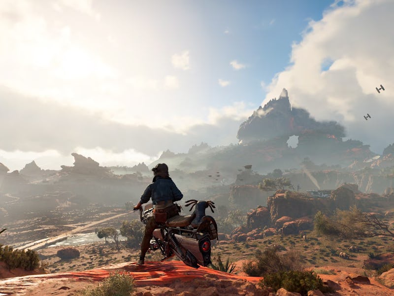 A character on a futuristic motorcycle overlooks a sprawling desert landscape with rocky formations ...