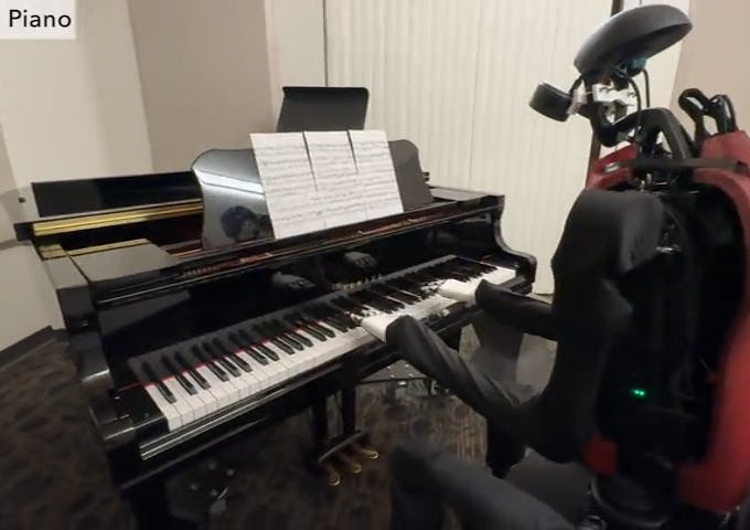 Robot playing a grand piano in a room. Sheet music is placed on the piano, and the robot seems to be practicing.