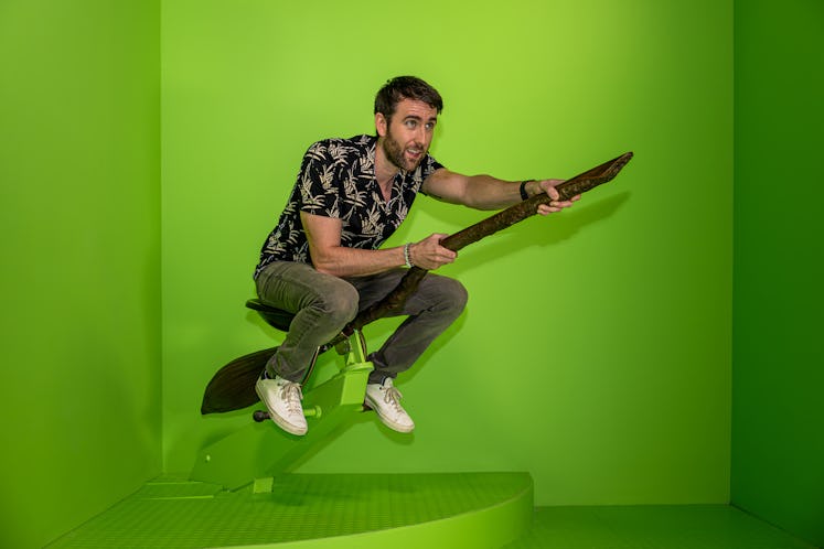 Matthew Lewis (aka Neville Longbottom) riding a broomstick at Harry Potter New York.