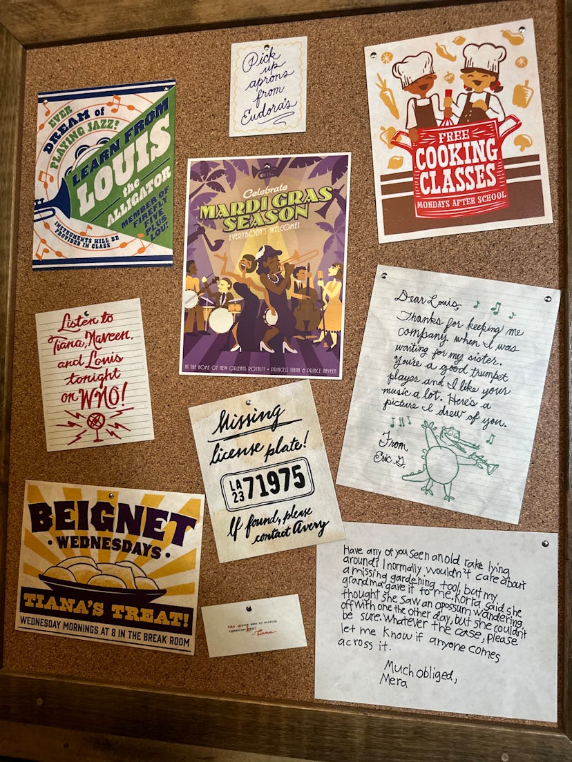 In the queue for Disney's 'Tiana's Bayou Adventure' ride, a corkboard in Tiana's kitchen holds notes...