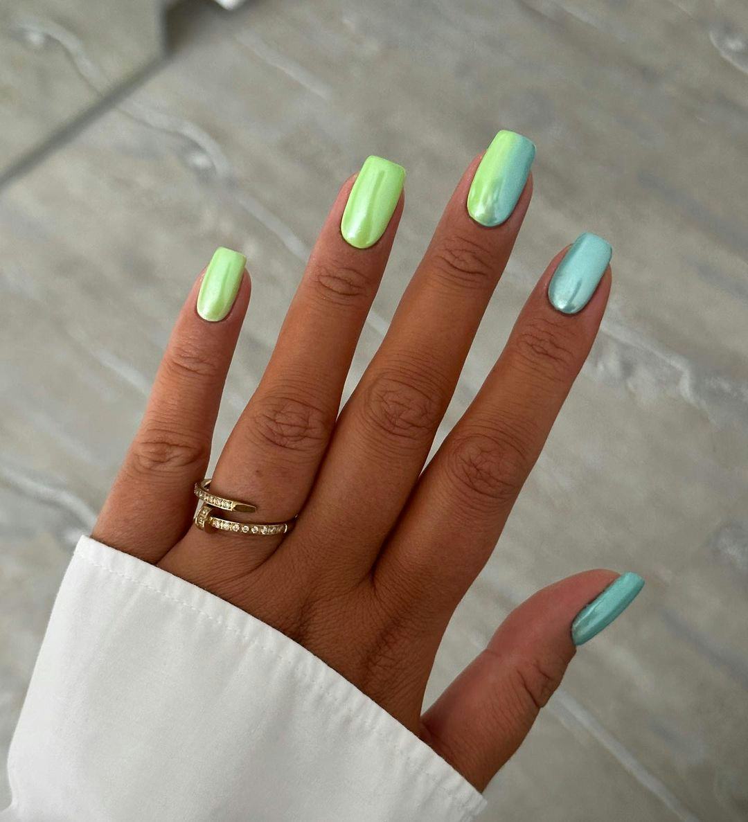 Blue and green chrome nails are perfect for Cancer season 2024.