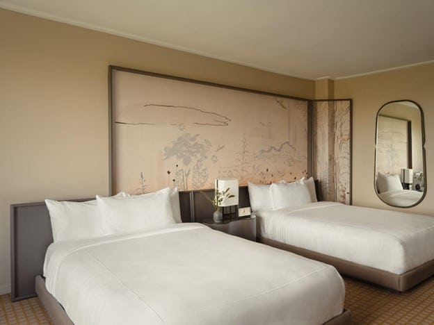 Unwind in rooms and suites featuring hand-painted murals, unobstructed park views, and cozy comforts