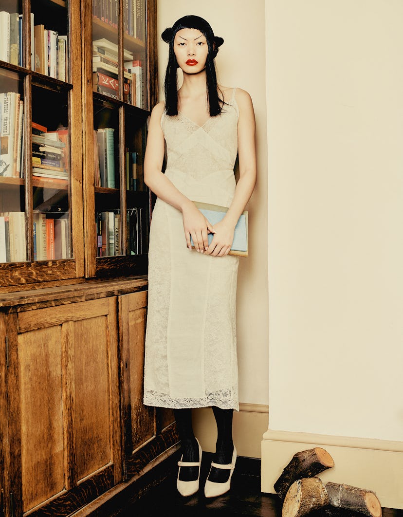 Bingbing Liu wearing a white lace camisole and skirt