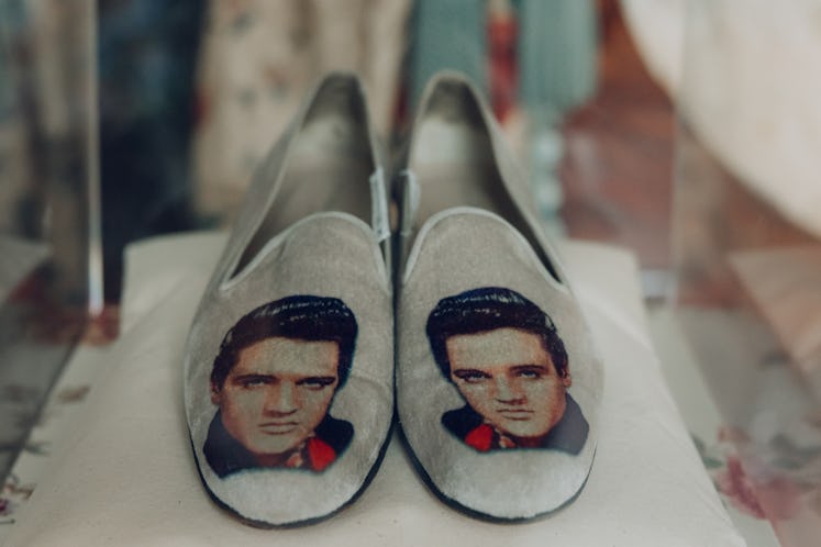 a pair of slippers with pictures of elvis on them