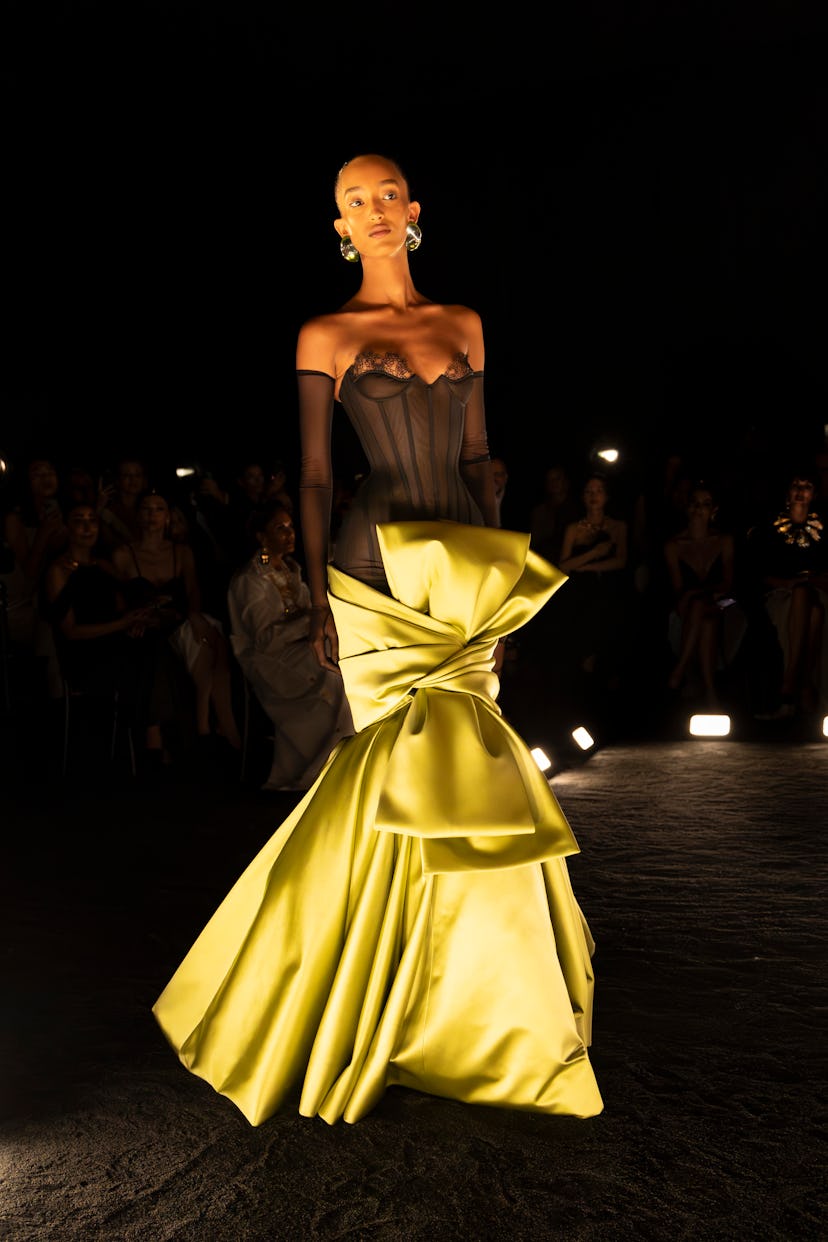 Mona Touggard walks the runway