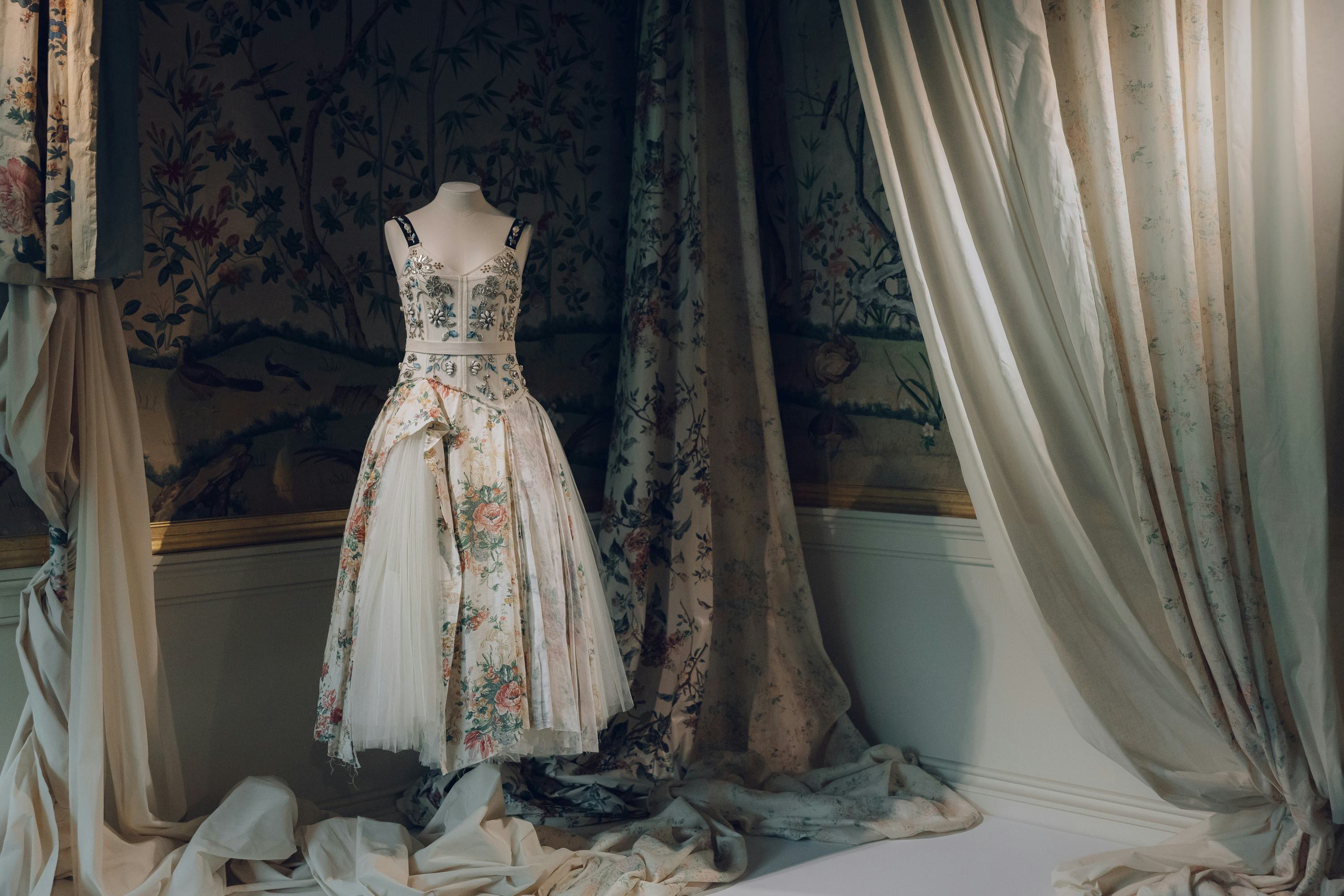 a dress form with a floral dress on it