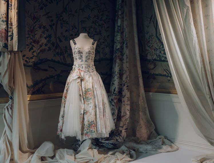 a dress form with a floral dress on it