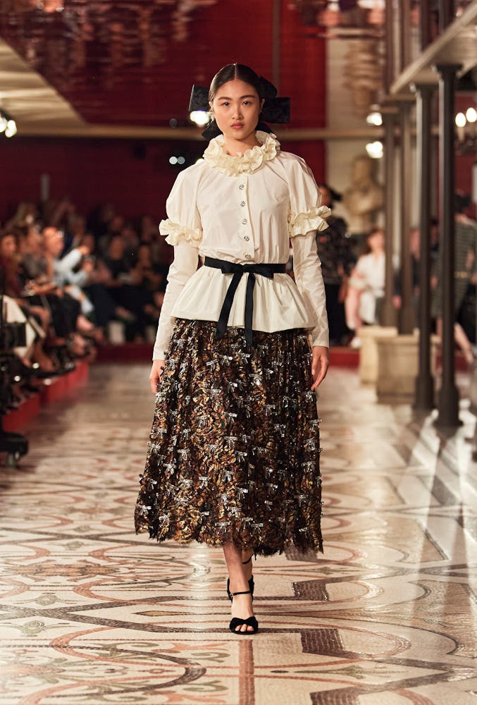 a look from chanel couture fall 2024 collection runway show in paris